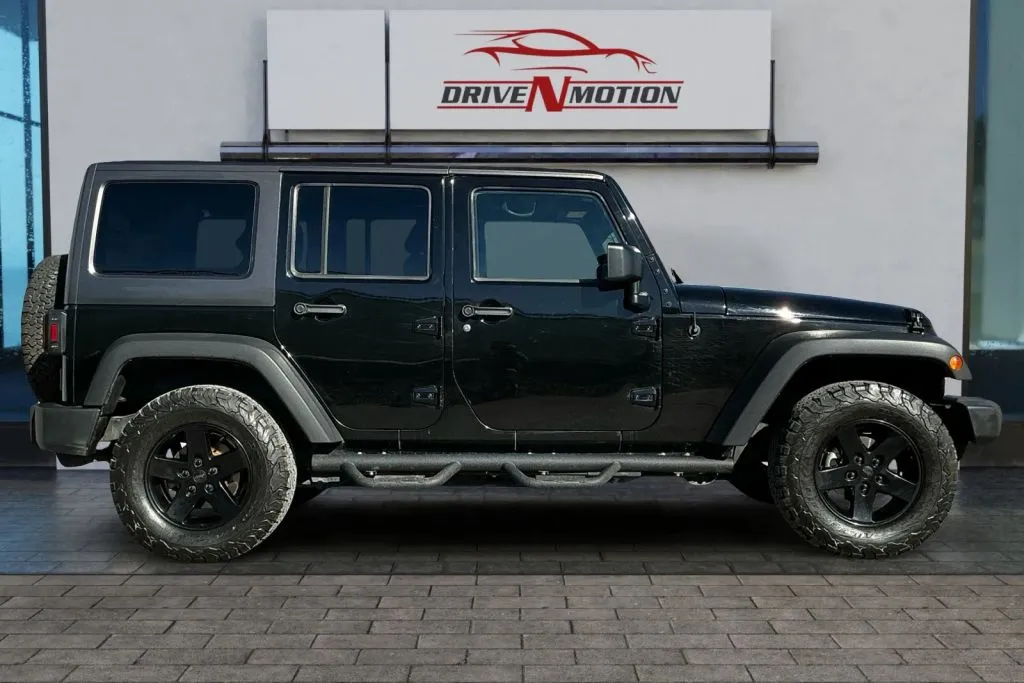 Another view of 2017 Jeep Wrangler Unlimited Sport SUV 4D for sale in Greeley, CO at Drive N-Motion Greeley