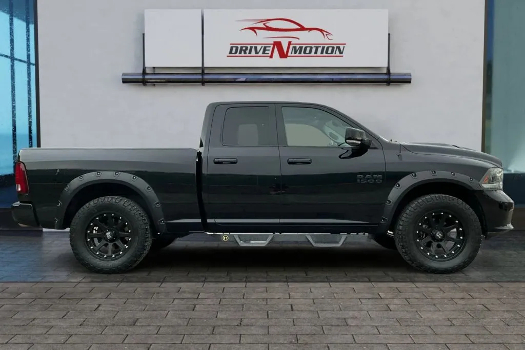 Photos of 2015 Ram 1500 Quad Cab Sport Pickup 4D 6 1/3 ft for sale in Greeley, CO at Drive N-Motion Greeley