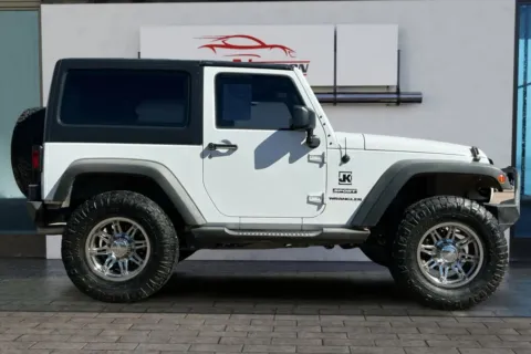 Another view of 2013 Jeep Wrangler Sport SUV 2D for sale in Greeley, CO at Drive N-Motion Greeley