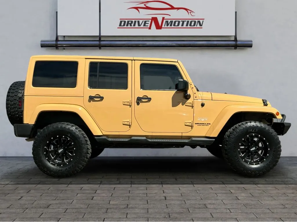 Another view of 2013 Jeep Wrangler Unlimited Sahara Sport Utility 4D for sale in Greeley, CO at Drive N-Motion Greeley