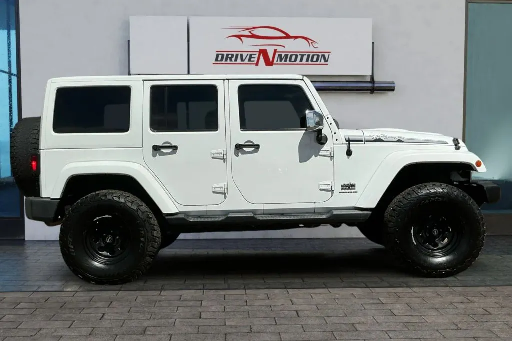 Photos of 2014 Jeep Wrangler Unlimited Polar Edition Sport Utility 4D for sale in Greeley, CO at Drive N-Motion Greeley