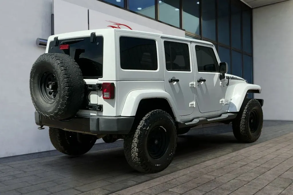 Another view of 2014 Jeep Wrangler Unlimited Polar Edition Sport Utility 4D for sale in Greeley, CO at Drive N-Motion Greeley