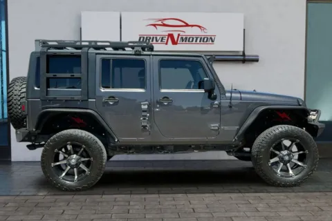 Another view of 2014 Jeep Wrangler Unlimited Sport SUV 4D for sale in Greeley, CO at Drive N-Motion Greeley