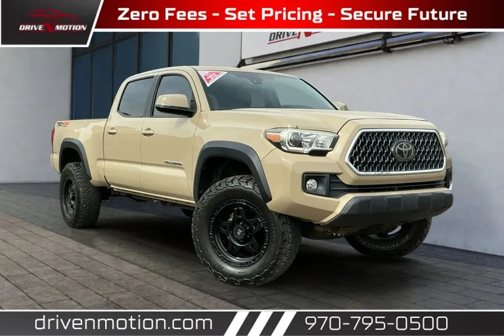 Beige 2018 Toyota Tacoma Double Cab TRD Off-Road Pickup 4D 6 ft for sale in Greeley, CO