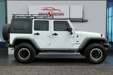 Another view of 2014 Jeep Wrangler Unlimited Sport SUV 4D for sale in Greeley, CO at Drive N-Motion Greeley