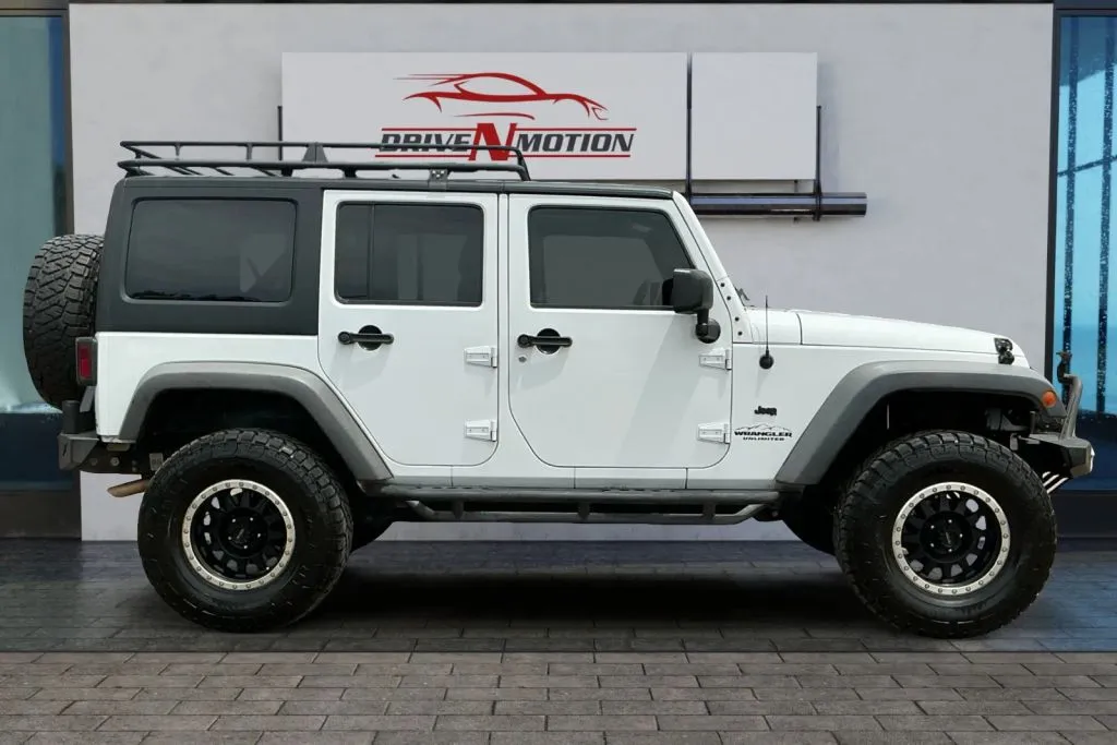 Another view of 2014 Jeep Wrangler Unlimited Sport SUV 4D for sale in Greeley, CO at Drive N-Motion Greeley