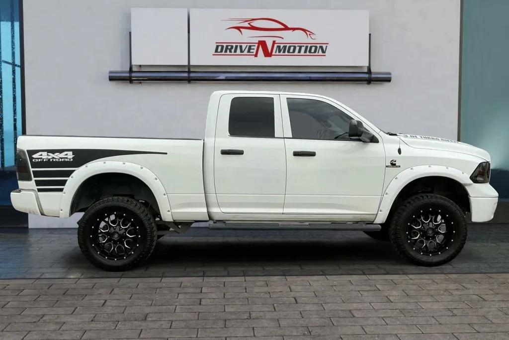 Photos of 2014 Ram 1500 Quad Cab Tradesman Pickup 4D 6 1/3 ft for sale in Greeley, CO at Drive N-Motion Greeley