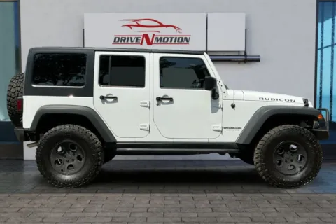 Another view of 2014 Jeep Wrangler Unlimited Rubicon Sport Utility 4D for sale in Greeley, CO at Drive N-Motion Greeley