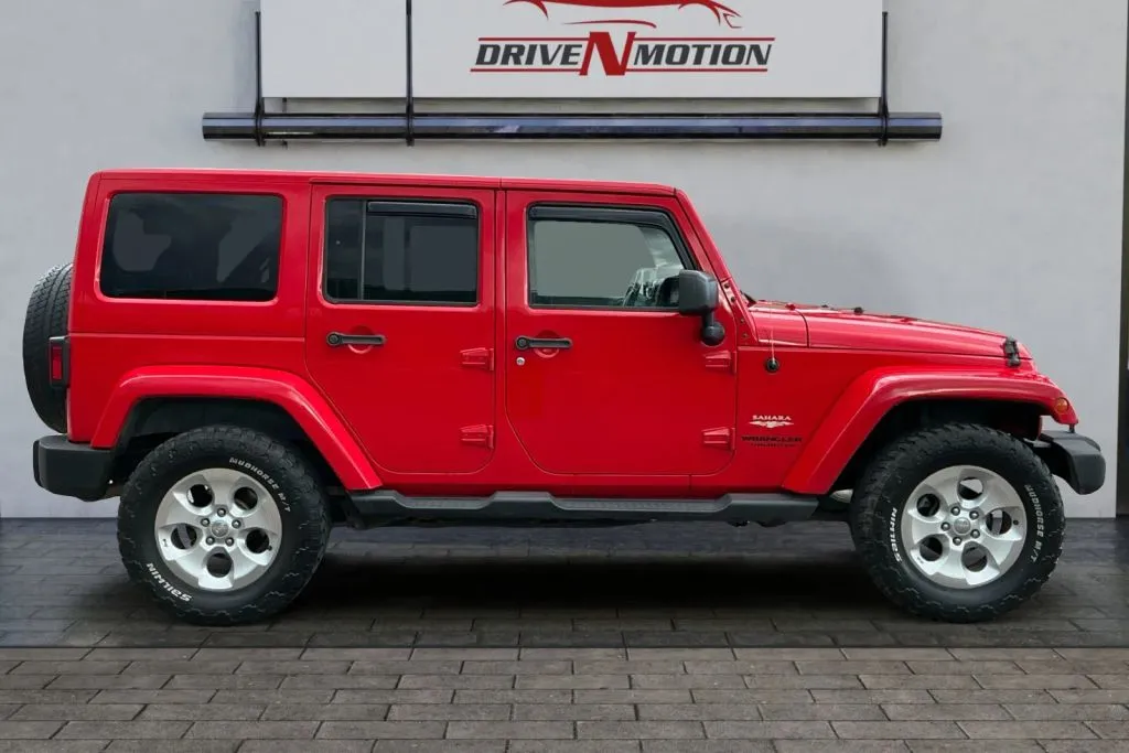 Another view of 2015 Jeep Wrangler Unlimited Sahara Sport Utility 4D for sale in Greeley, CO at Drive N-Motion Greeley
