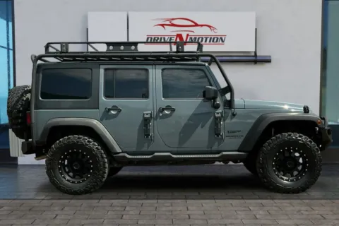 Photos of 2014 Jeep Wrangler Unlimited Sport SUV 4D for sale in Greeley, CO at Drive N-Motion Greeley