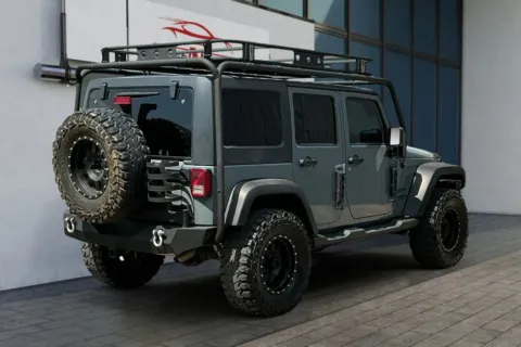 Another view of 2014 Jeep Wrangler Unlimited Sport SUV 4D for sale in Greeley, CO at Drive N-Motion Greeley
