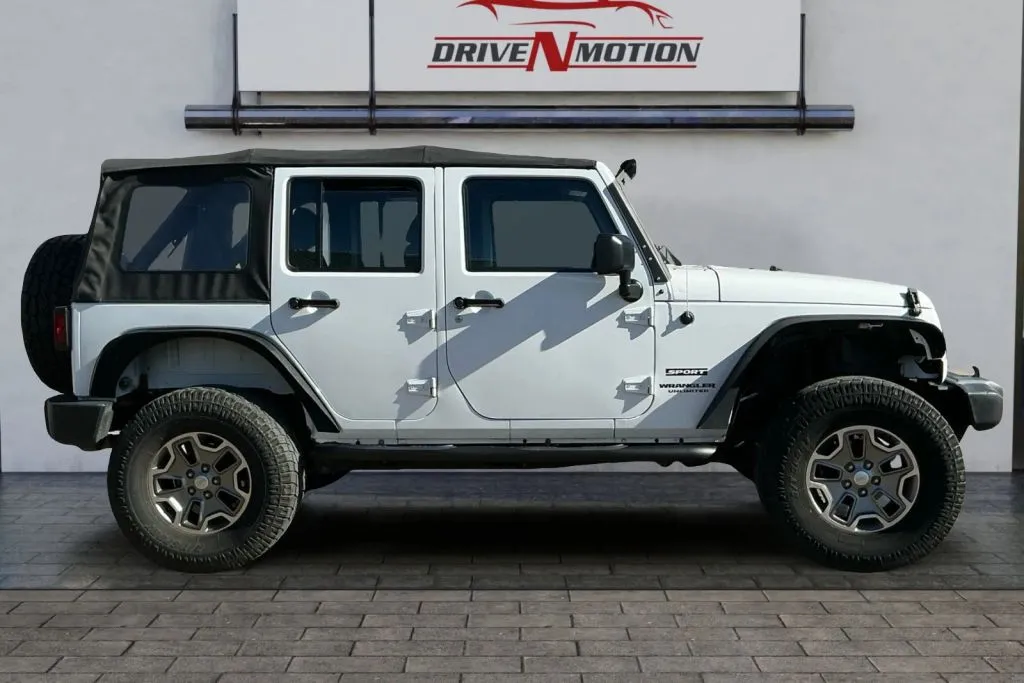 Another view of 2017 Jeep Wrangler Unlimited Sport SUV 4D for sale in Greeley, CO at Drive N-Motion Greeley
