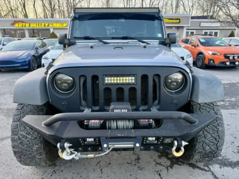 Another view of 2015 Jeep Wrangler Unlimited Willys Wheeler Sport Utility 4D for sale in East Stroudsburg, PA at Auto Valley Group