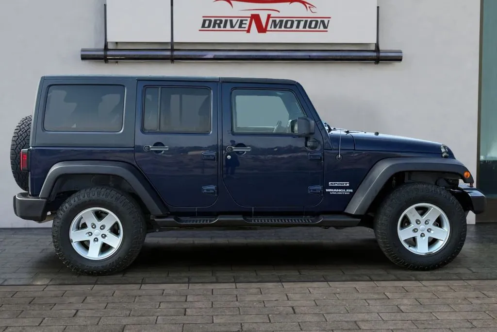 Another view of 2013 Jeep Wrangler Unlimited Sport SUV 4D for sale in Rio Rancho, NM at Drive N-Motion Rio Rancho