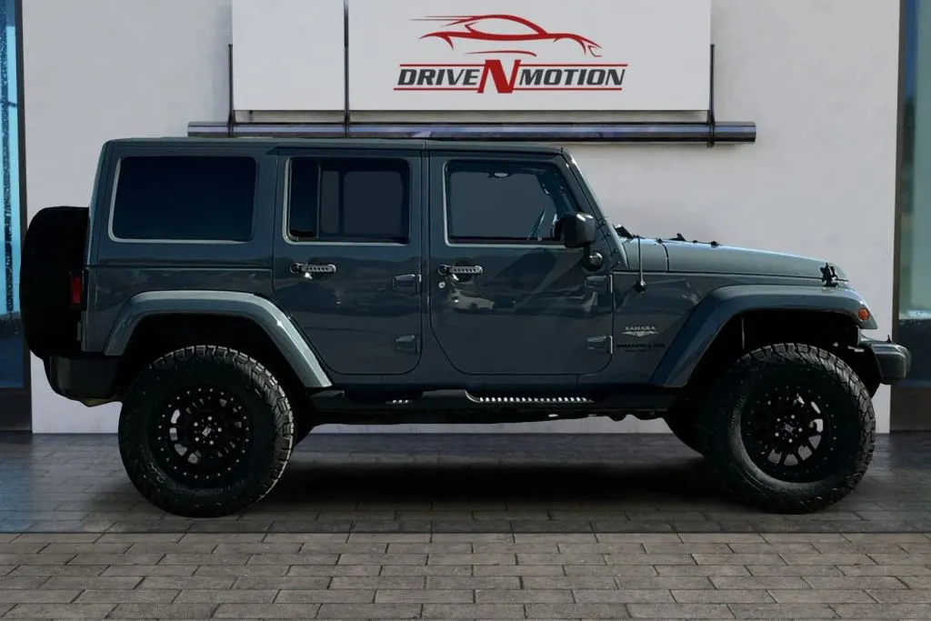 Another view of 2015 Jeep Wrangler Unlimited Sahara Sport Utility 4D for sale in Rio Rancho, NM at Drive N-Motion Rio Rancho