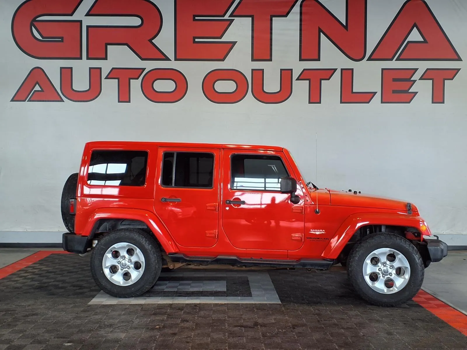 Orange 2013 Jeep Wrangler Unlimited Sahara for sale in Gretna, NE