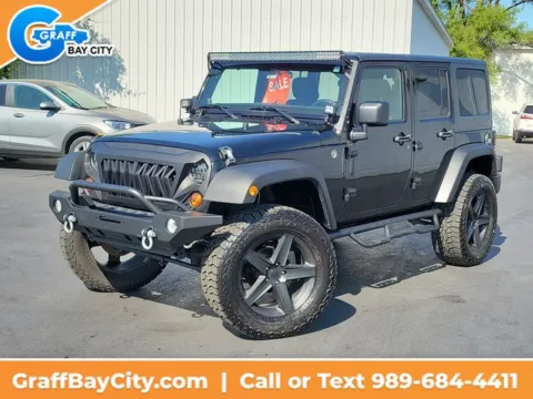 Black 2012 Jeep Wrangler Unlimited Sport for sale in Bay City, MI