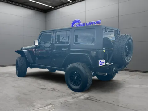 Another view of 2014 Jeep Wrangler Unlimited Rubicon for sale in Denver, CO at New Wave Automotive