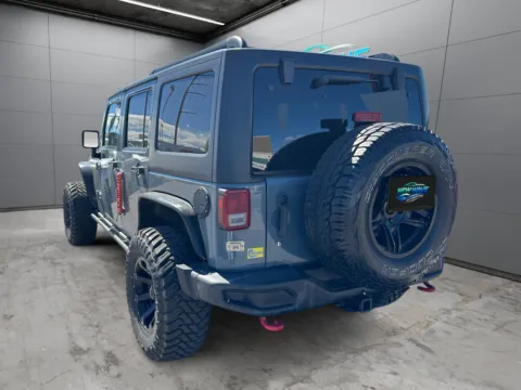 Another view of 2013 Jeep Wrangler Unlimited Rubicon 10th Anniversary for sale in Denver, CO at New Wave Automotive