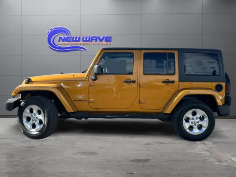 Photos of 2014 Jeep Wrangler Unlimited Sahara for sale in Denver, CO at New Wave Automotive