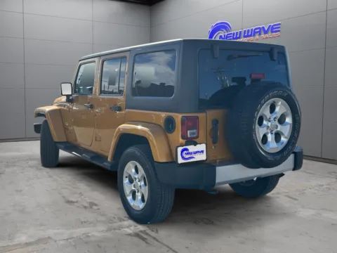 Another view of 2014 Jeep Wrangler Unlimited Sahara for sale in Denver, CO at New Wave Automotive