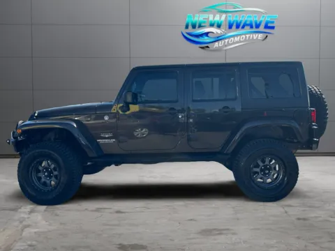 Photos of 2013 Jeep Wrangler Unlimited Sahara for sale in Denver, CO at New Wave Automotive