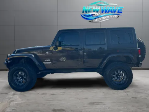 Photos of 2013 Jeep Wrangler Unlimited Sahara for sale in Denver, CO at New Wave Automotive