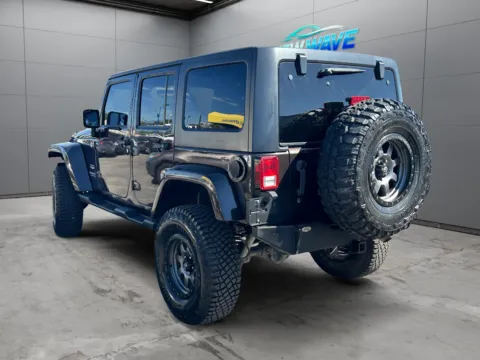 Another view of 2013 Jeep Wrangler Unlimited Sahara for sale in Denver, CO at New Wave Automotive