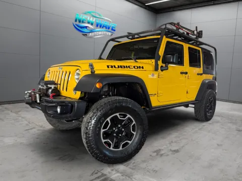 Yellow 2015 Jeep Wrangler Unlimited Rubicon Hard Rock for sale in Denver, CO