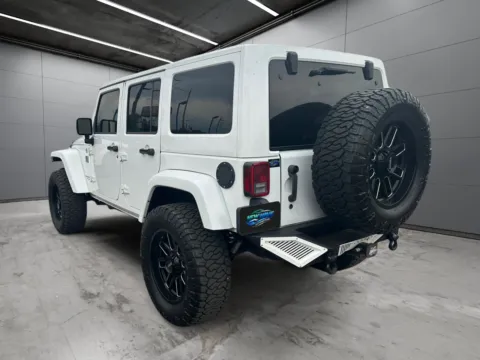 Another view of 2014 Jeep Wrangler Unlimited Altitude for sale in Denver, CO at New Wave Automotive