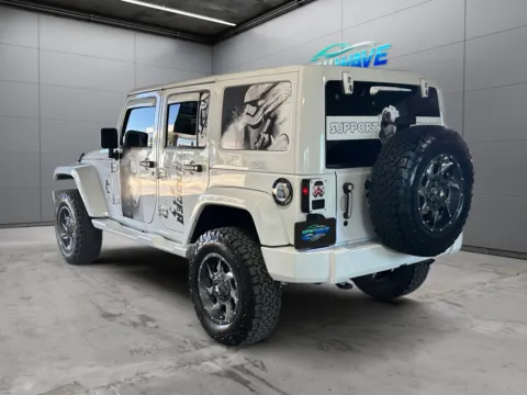 Another view of 2015 Jeep Wrangler Unlimited Sahara for sale in Denver, CO at New Wave Automotive