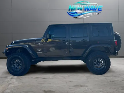 Photos of 2013 Jeep Wrangler Unlimited Sahara for sale in Denver, CO at New Wave Automotive