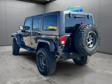 Another view of 2013 Jeep Wrangler Unlimited Sahara for sale in Denver, CO at New Wave Automotive
