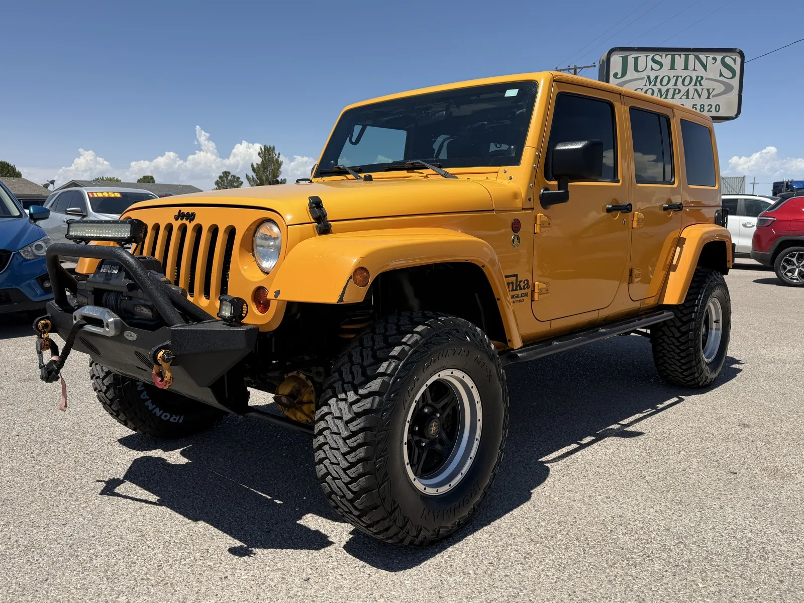 Yellow 2012 JEEP WRANGLER UNLIMI SAHARA for sale in Alamogordo, NM