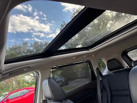 Photos of 2023 Nissan Rogue SV AWD w/PREMIUM PKG. LTHR. PANO. for sale in Seffner, FL at Evo Motors