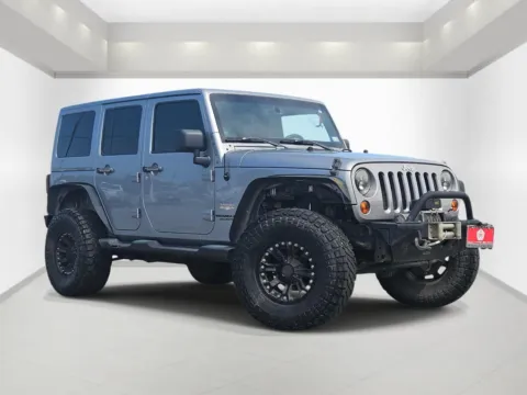 Silver 2013 Jeep Wrangler Unlimited Sahara for sale in Bonham, TX
