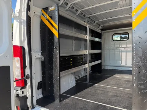 Another view of 2024 Ram ProMaster 2500 High Roof 159WB w/3-Person Bench, Shelves, and Ladder Rack for sale in Concord, NC at Carolina Auto Warehouse