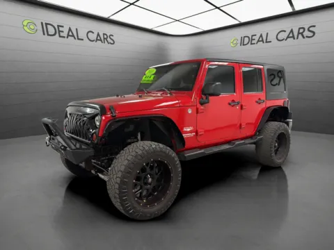 Red 2011 Jeep Wrangler Unlimited Sahara for sale in Mesa, AZ