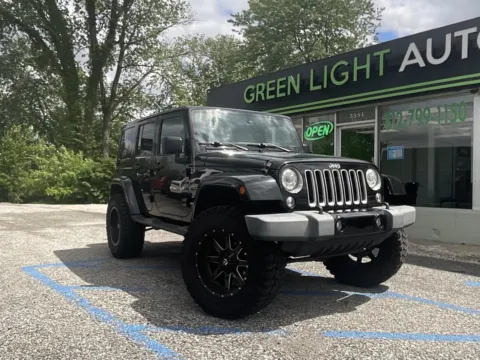 Black 2017 Jeep Wrangler Unlimited Sahara for sale in Columbus, IN