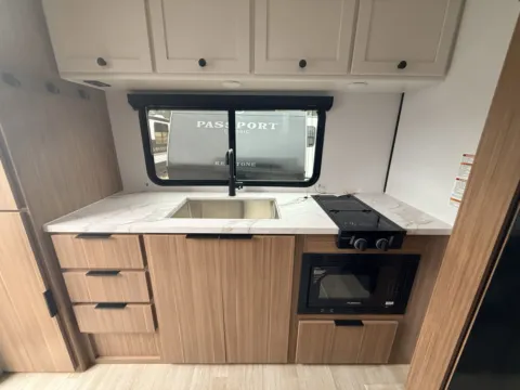 Another view of 2026 KEYSTONE PASSPORT 210RKC for sale in Gulfport, MS at County Line Campers