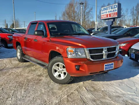 Orange 2008 Dodge Dakota Crew Cab SLT Pickup 4D 5 1/4 ft for sale in Anchorage, AK