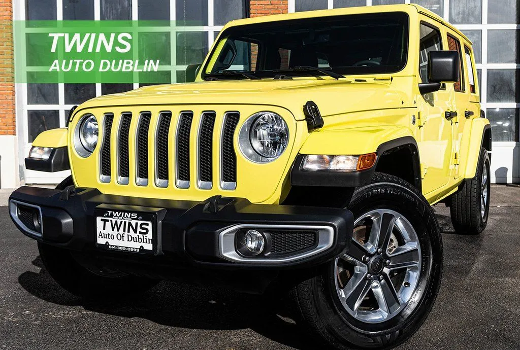 Yellow 2023 Jeep Wrangler Sahara for sale in Dublin, OH