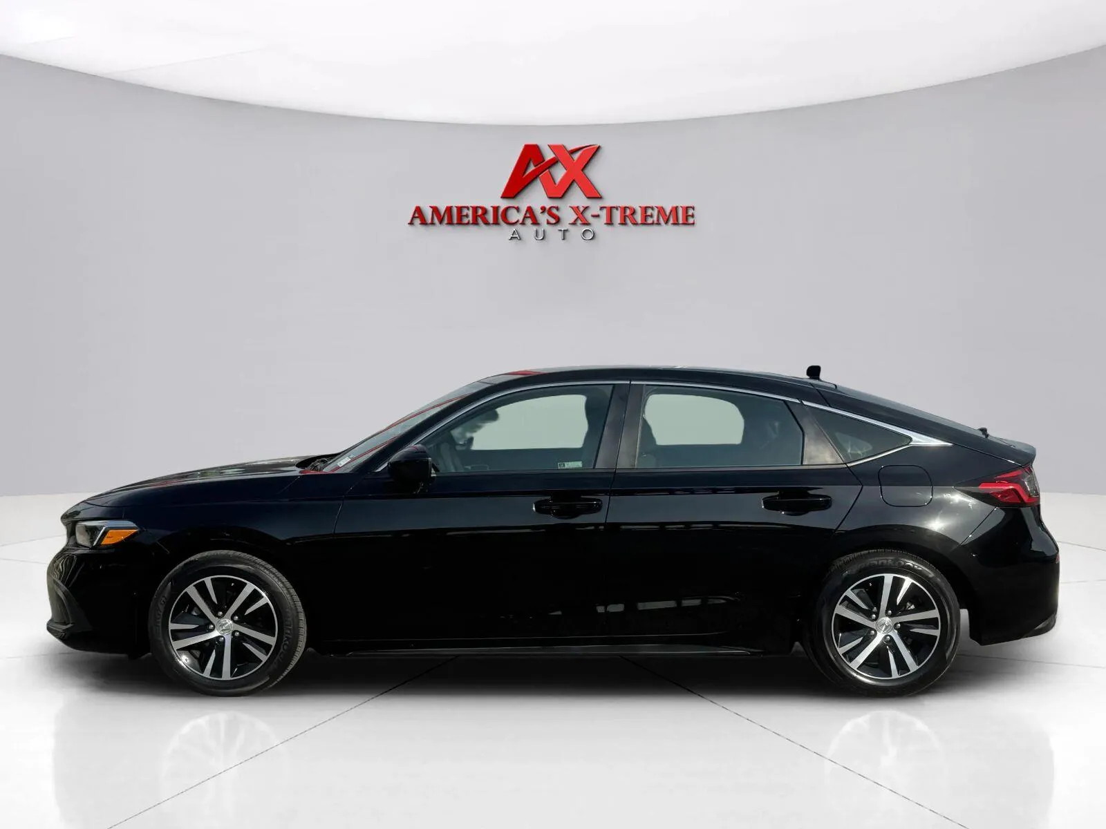 Photos of 2023 Honda Civic Hatchback LX for sale in Houston, TX at America's Xtreme Auto Sales & Auto Repair | Luxury Used Cars & Trucks Dealership