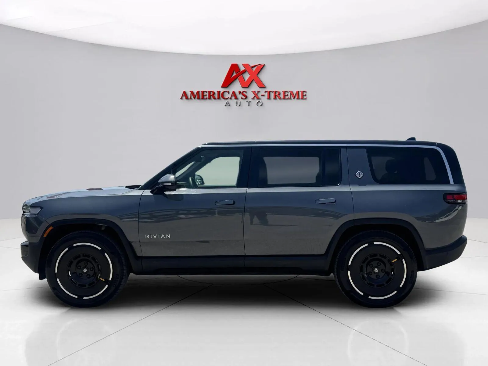 Photos of 2025 Rivian R1S Adventure for sale in Houston, TX at America's Xtreme Auto Sales & Auto Repair | Luxury Used Cars & Trucks Dealership