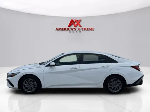 Photos of 2024 Hyundai Elantra Hybrid Blue for sale in Houston, TX at America's Xtreme Auto Sales & Auto Repair | Luxury Used Cars & Trucks Dealership
