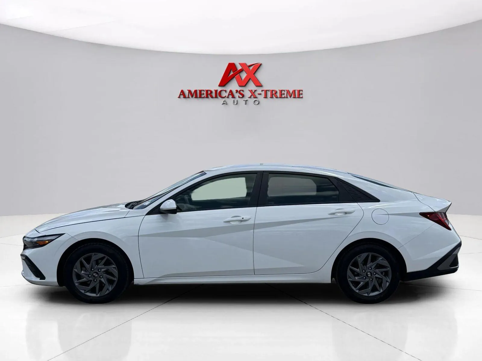 Photos of 2024 Hyundai Elantra Hybrid Blue for sale in Houston, TX at America's Xtreme Auto Sales & Auto Repair | Luxury Used Cars & Trucks Dealership