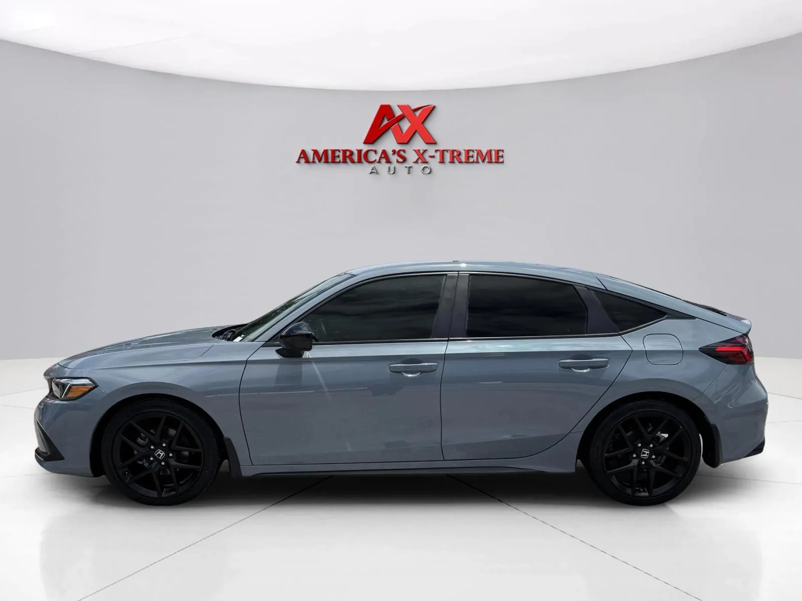 Photos of 2024 Honda Civic Hatchback Sport for sale in Houston, TX at America's Xtreme Auto Sales & Auto Repair | Luxury Used Cars & Trucks Dealership