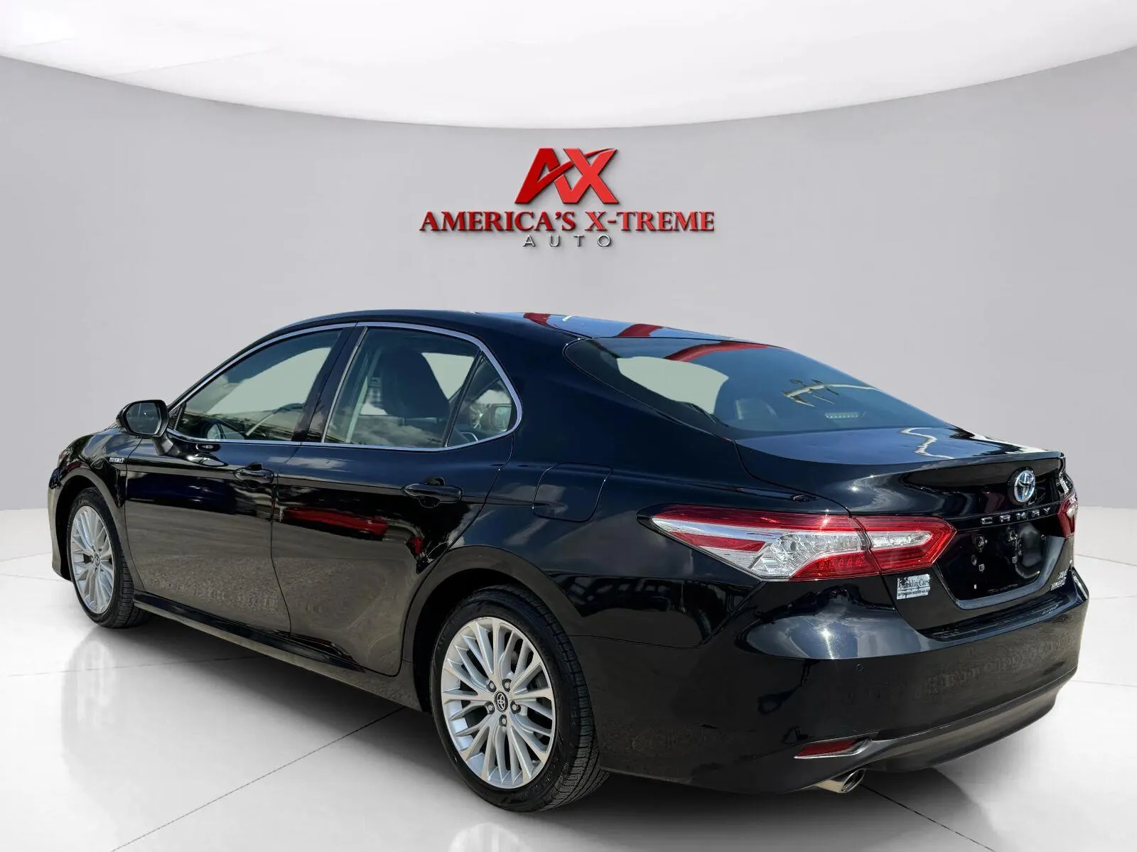 Another view of 2018 Toyota Camry Hybrid XLE for sale in Houston, TX at America's Xtreme Auto Sales & Auto Repair | Luxury Used Cars & Trucks Dealership