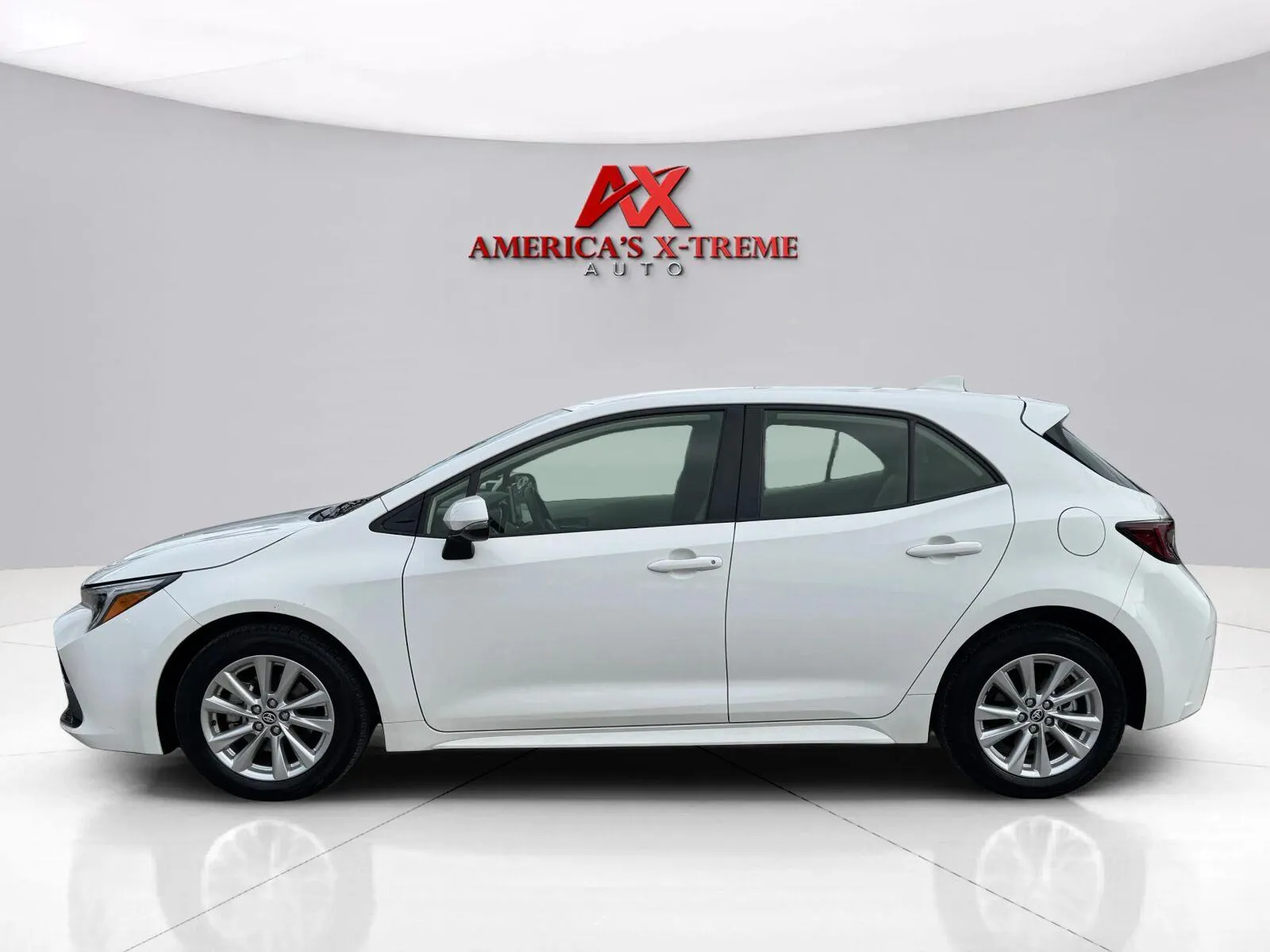 Photos of 2024 Toyota Corolla Hatchback SE for sale in Houston, TX at America's Xtreme Auto Sales & Auto Repair | Luxury Used Cars & Trucks Dealership