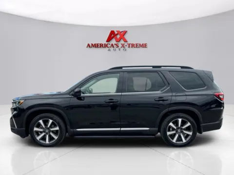 Photos of 2023 Honda Pilot Touring for sale in Houston, TX at America's Xtreme Auto Sales & Auto Repair | Luxury Used Cars & Trucks Dealership